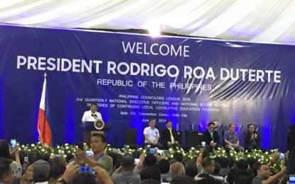 <p><strong>THE PRESIDENT MEETS THE COUNCILORS. </strong> President Rodrigo R. Duterte urges the 3,000 members of the Philippine Councilors League (PCL) to help him fight the drug menace during a speech at the PCL convention in Iloilo City on Wednesday (June 20, 2018.) <em>(Photo by Cindy Ferrer) </em></p>